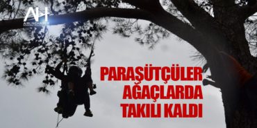 Paraşütçüler ağaçlarda takılı kaldı